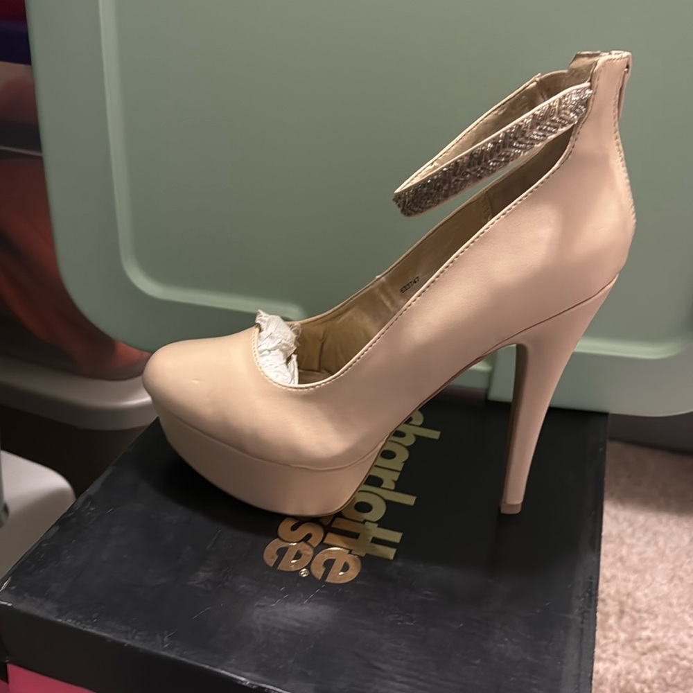 A high heel tan with strap across top